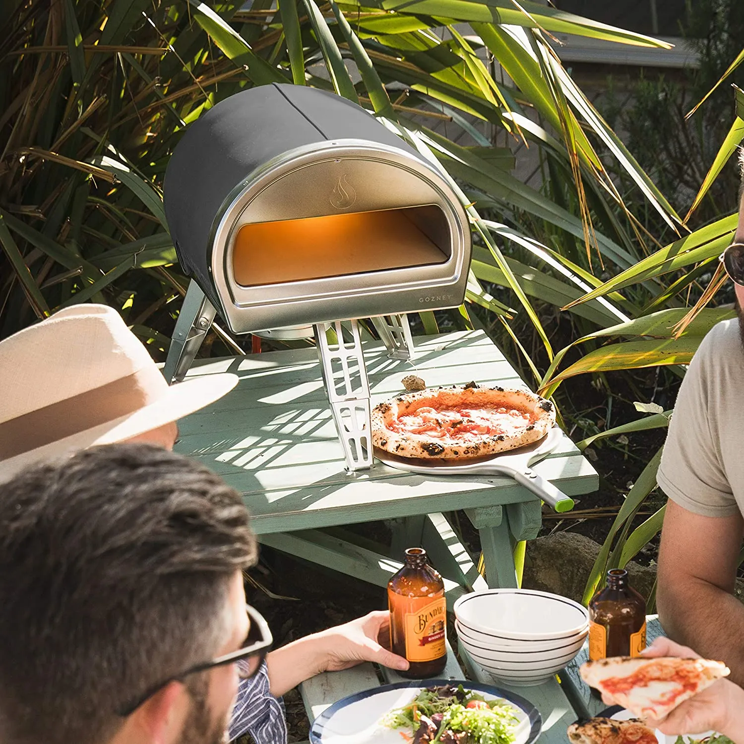 ROCCBOX Gozney Portable Outdoor Pizza Oven - Includes Professional Grade Pizza Peel, Built-In Thermometer and Safe Touch Silicone Jacket - Propane Gas Fired, With Rolling Wood Flame - Grey